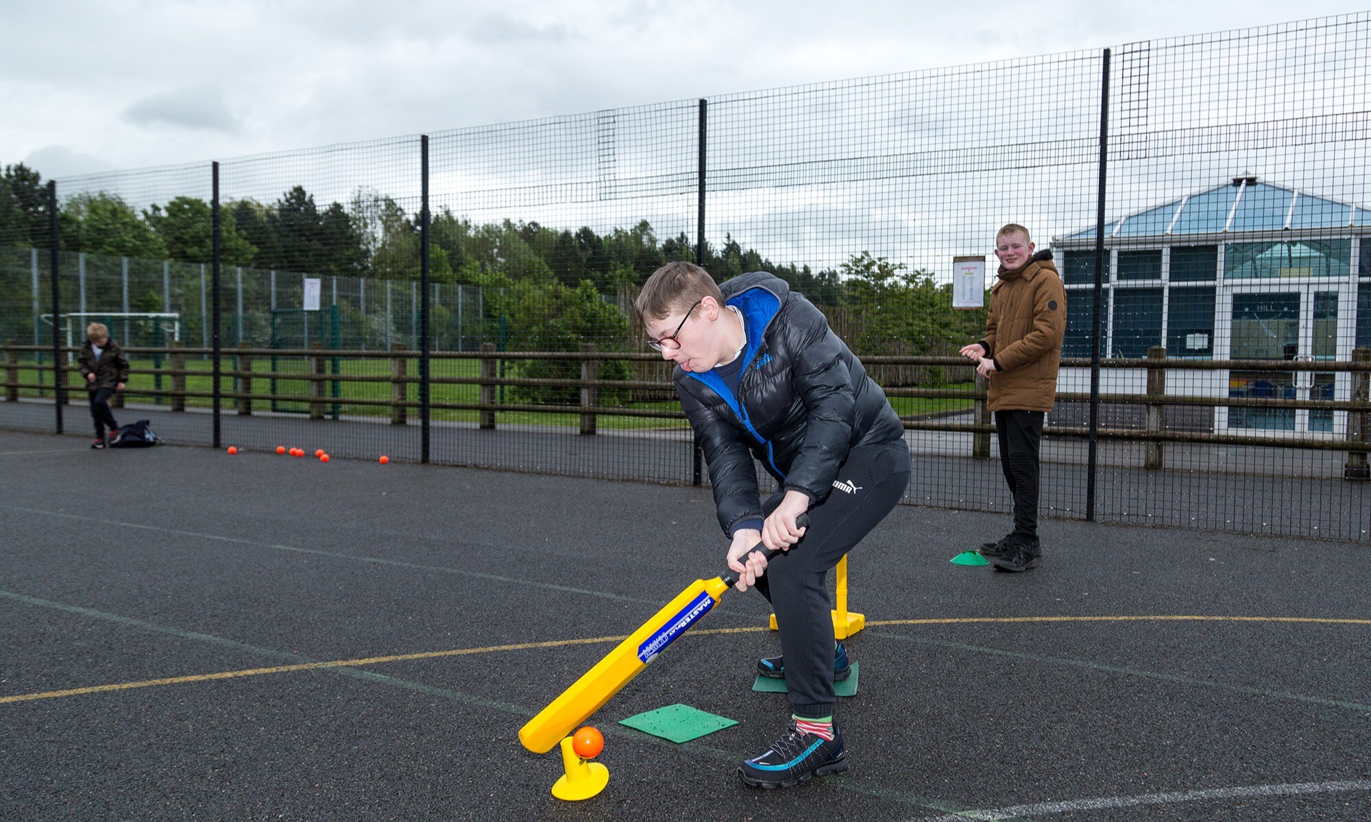 Piper Hill High School pupil playing cricket