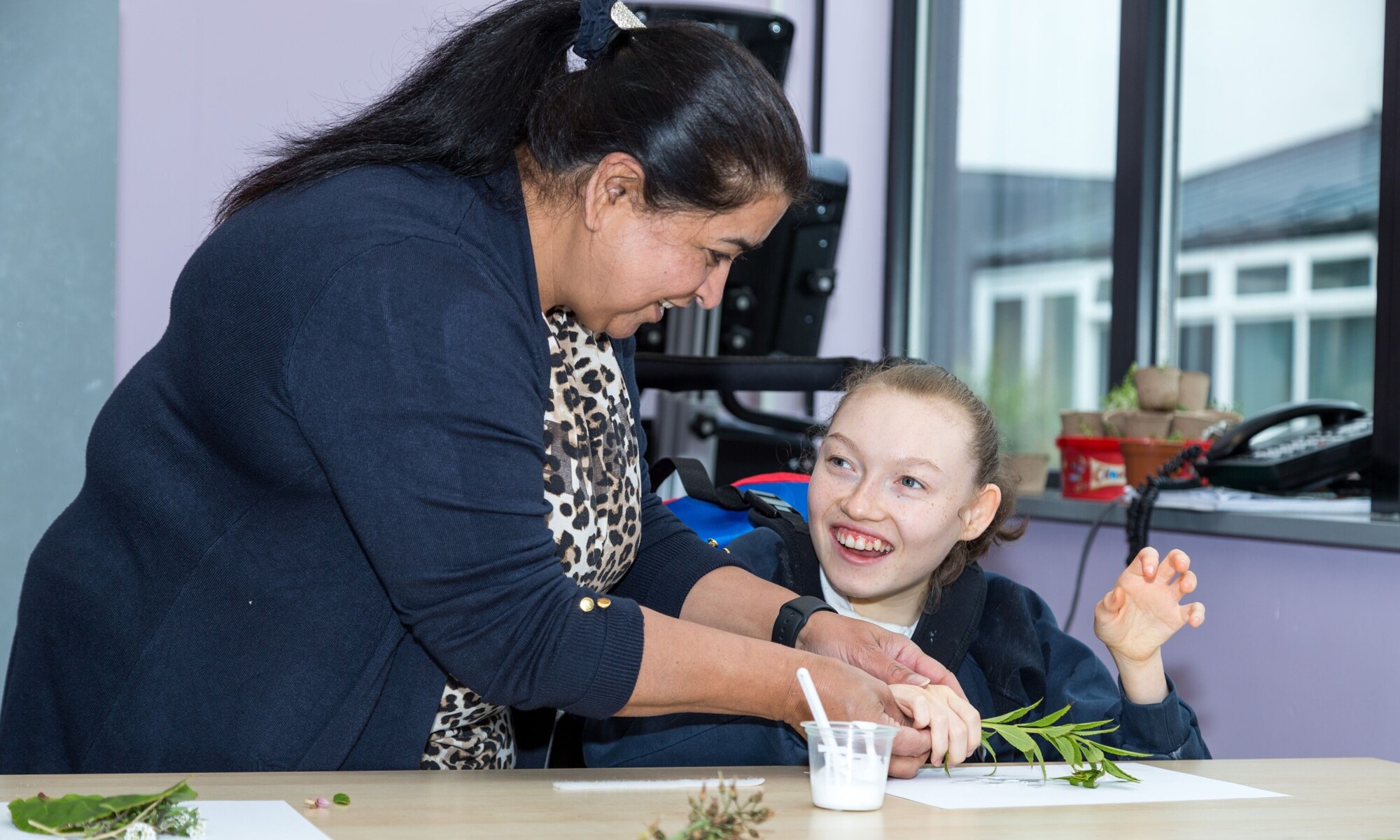 Piper Hill High School teacher helping pupil with school work